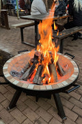 AlFresco Fire Pits by The Gas Boys featuring a modern outdoor fire pit with a circular design and stone base.