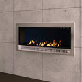 Close-up of Chad-O-Chef contemporary fireplace with stainless steel frame and MM back, showcasing modern design and sleek finish.
