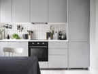 LUXE AM7006 60 cm electric oven with 70L capacity, featuring control knobs and digital display in a modern kitchen setting