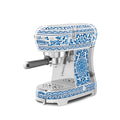 Smeg Dolce & Gabbana Blu Mediterraneo espresso coffee machine in sleek design with stainless steel finish and blue accents.