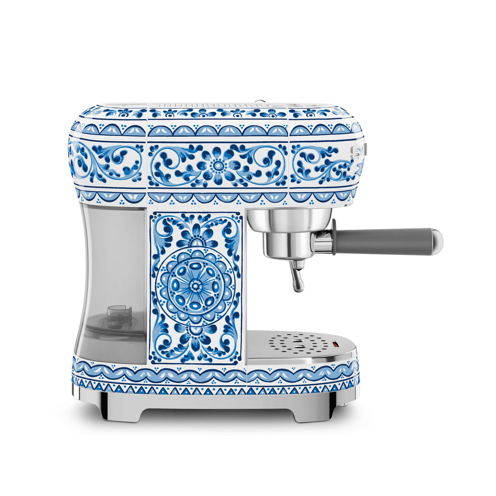 Smeg Dolce & Gabbana Blu Mediterraneo espresso coffee machine with sleek design and digital display, by The Gas Boys.