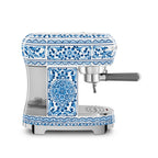 Smeg Dolce & Gabbana Blu Mediterraneo espresso coffee machine with sleek design and digital display, by The Gas Boys.