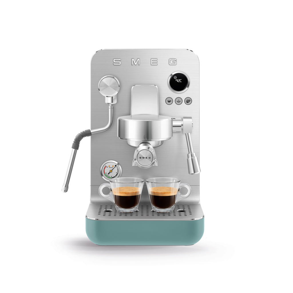 Smeg MiniPro Espresso Coffee Machine in stainless steel with black accents, compact design, and control panel on top.