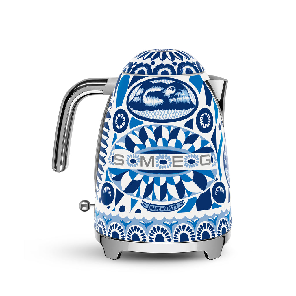 Smeg Dolce & Gabbana Blu Mediterraneo electric kettle with sleek blue and gold design, featuring a modern spout and handle.