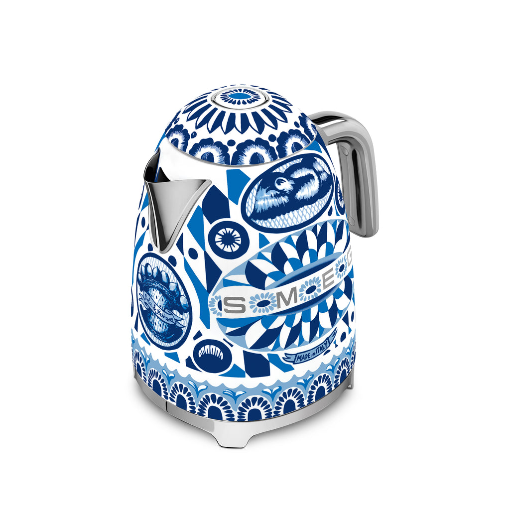 Smeg Dolce & Gabbana Blu Mediterraneo electric kettle with a sleek design, featuring a blue and silver finish and modern spout.