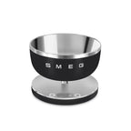Smeg Digital Kitchen Scale with black and white design, showing measurement display and weighing platform.