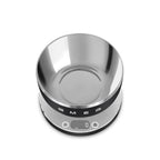 Smeg digital kitchen scale with a sleek black-and-white design and a digital display, perfect for precise food measurement.