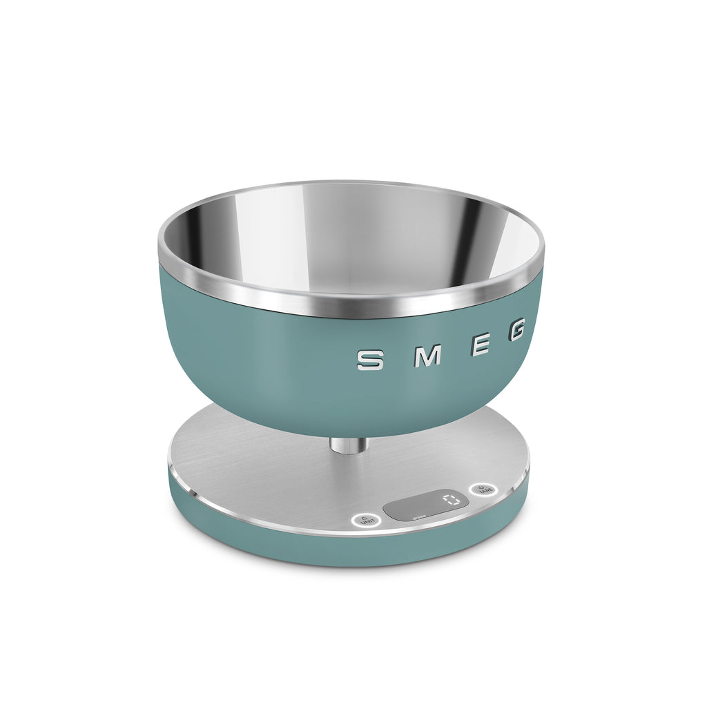 Digital kitchen scale by Smeg with a sleek design, featuring a clear digital display and stainless steel weighing surface.