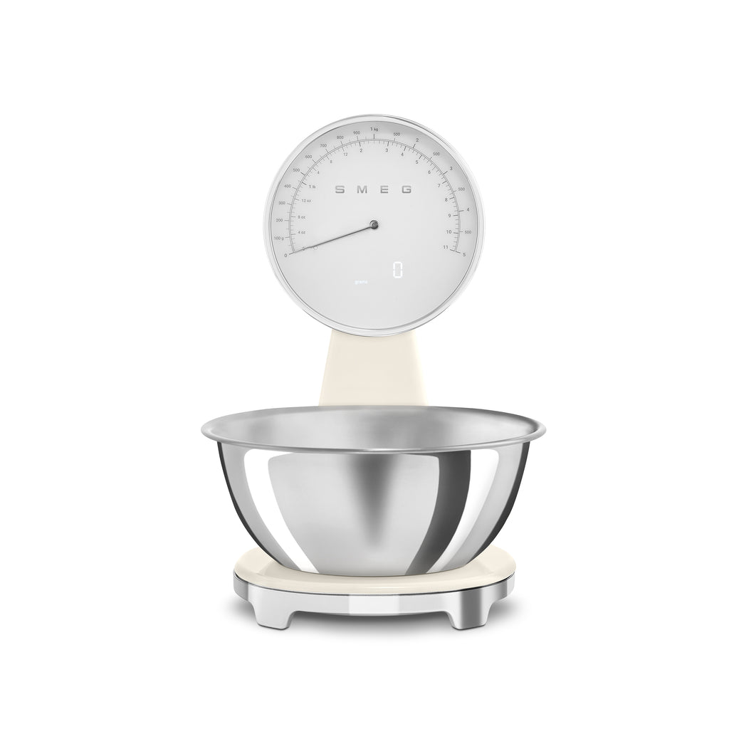 Smeg digital and analog kitchen scale with a sleek white design, featuring a digital display and a classic analog dial.