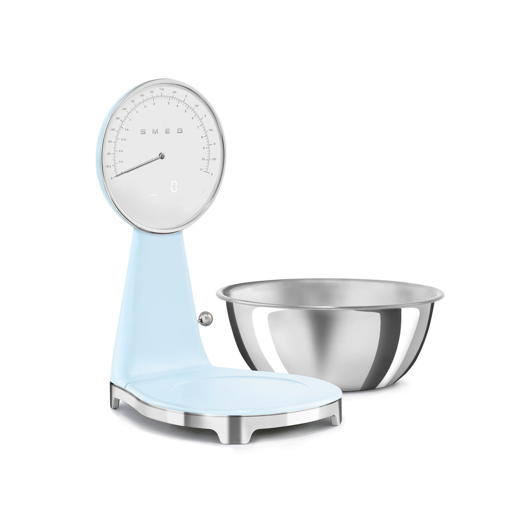 Smeg digital and analog kitchen scale with white and pastel pink design, featuring a sleek display and stainless steel platform.