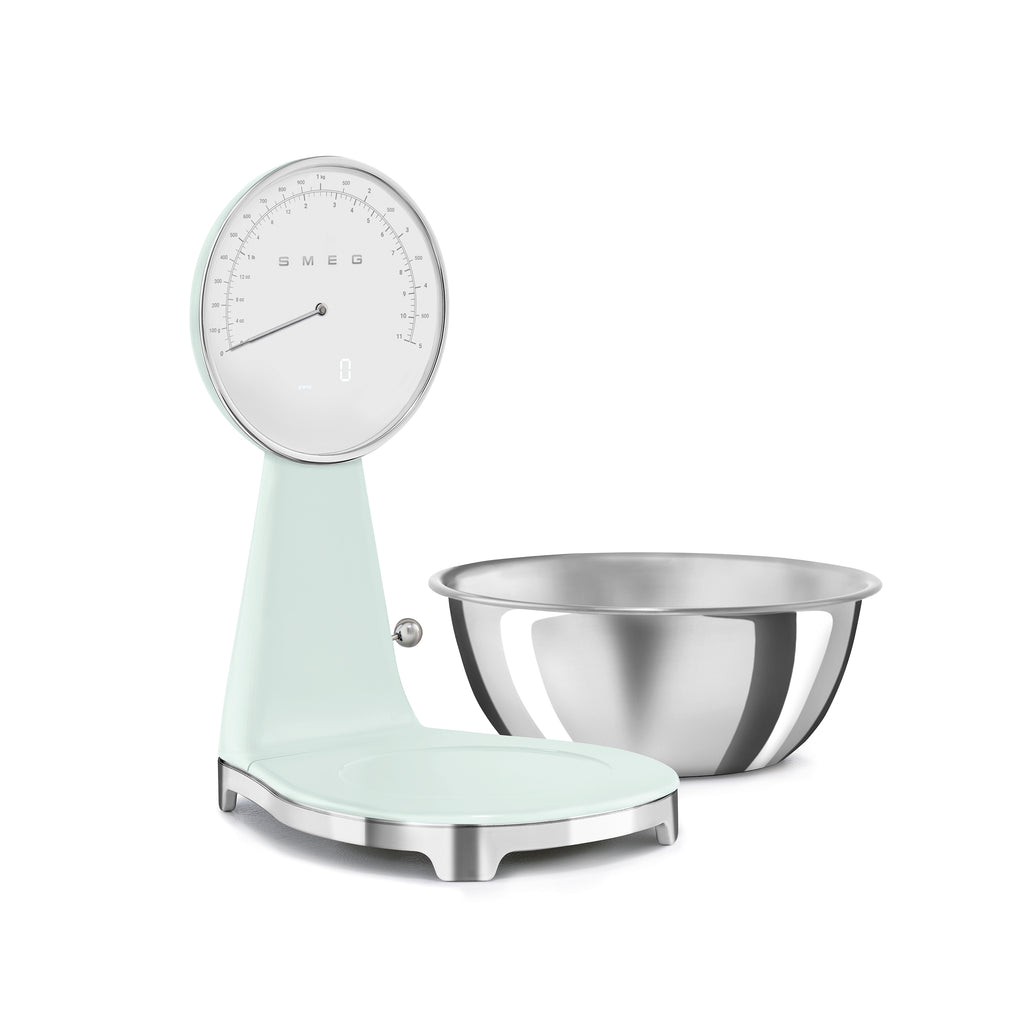 Smeg digital and analog kitchen scale with white finish, featuring a sleek modern design for precise food measurement.