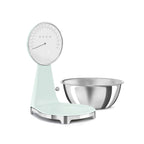 Smeg digital and analog kitchen scale with white finish, featuring a sleek modern design for precise food measurement.