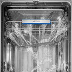 Smeg 60cm freestanding dishwasher in stainless steel with digital control panel and interior racks.