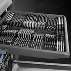 Smeg 60cm freestanding dishwasher in stainless steel with control panel and open door showing interior racks.