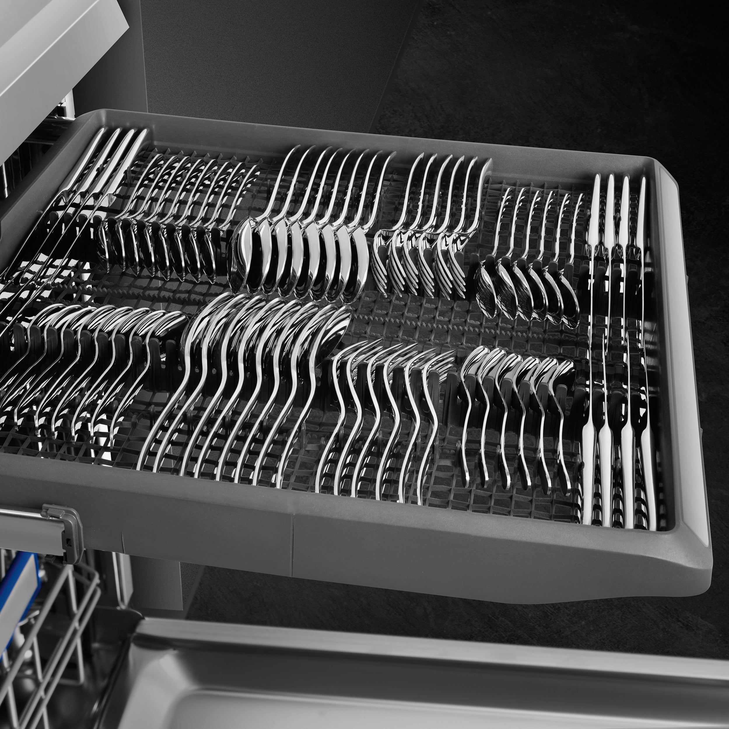 Smeg 60cm freestanding dishwasher in stainless steel with control panel and open door showing interior racks.