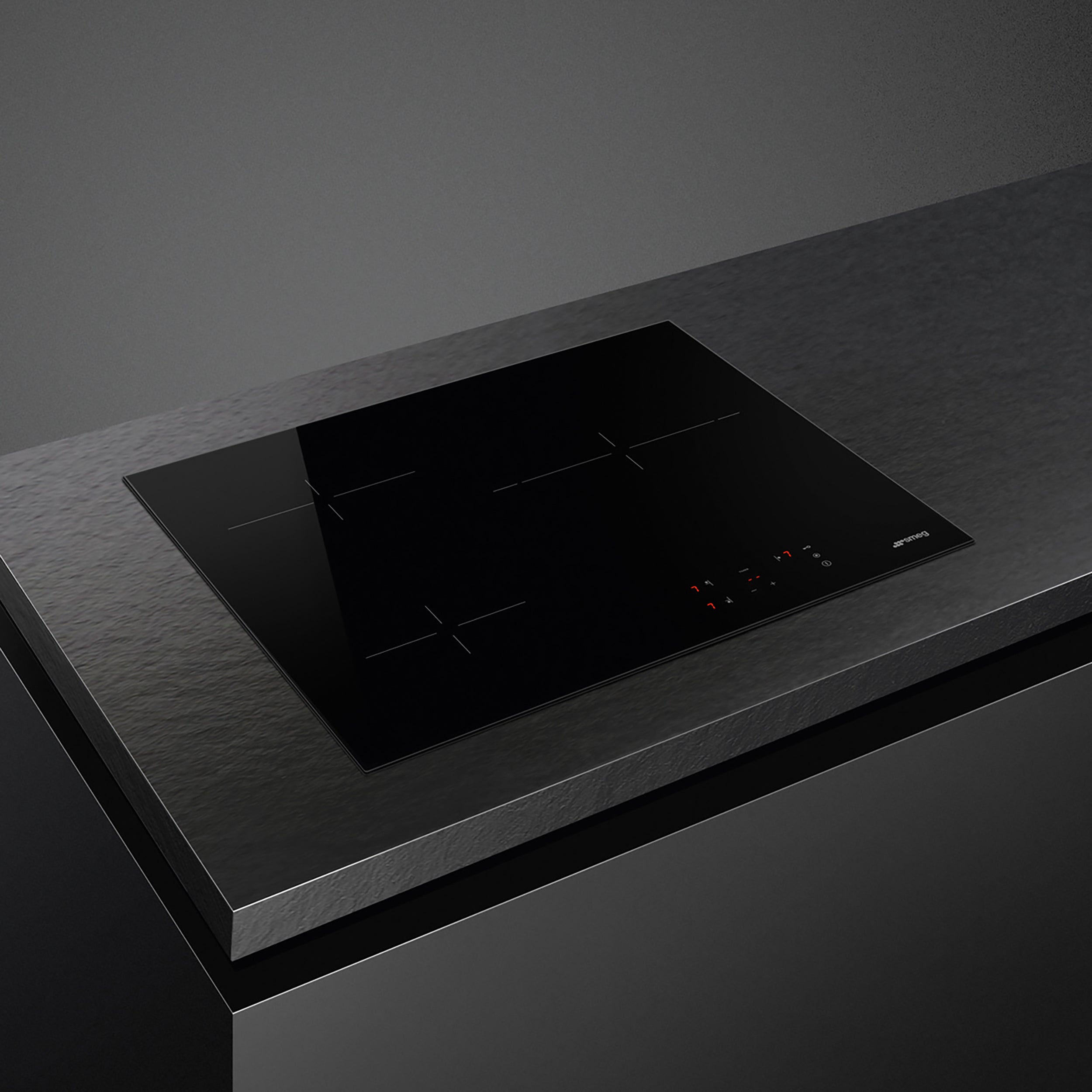 Smeg 60cm Ceran hob with four cooking zones and sleek black surface, installed in a modern kitchen setup.