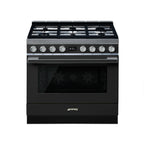 Smeg 90cm Portofino gas-electric cooker with four burners and oven, featuring a sleek modern design and stainless steel finish.