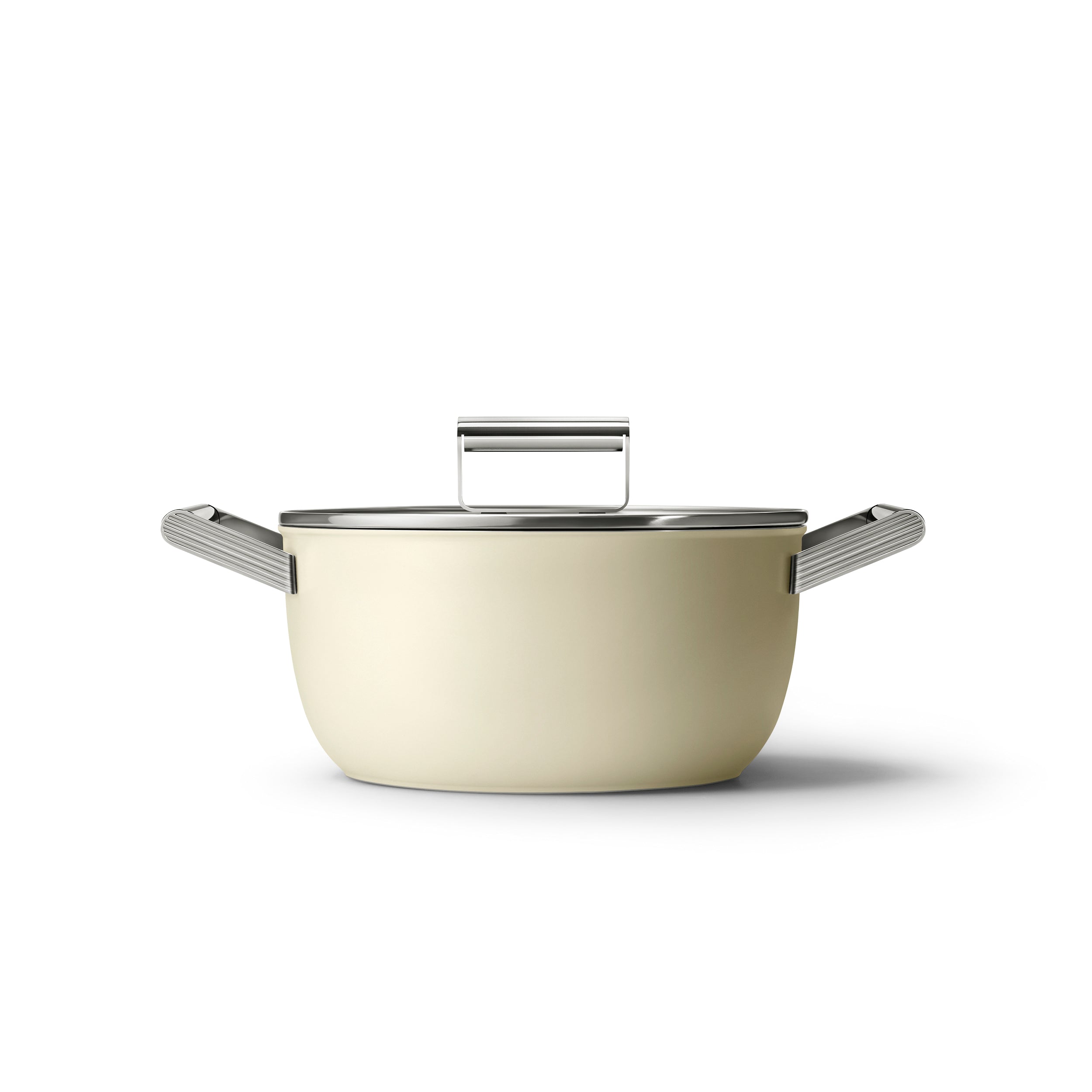 Cream-colored Smeg 24cm casserole pan with lid, featuring a sleek design and sturdy handles, ideal for versatile cooking.